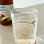 Glass of apple cider vinegar drink for weight loss on counter