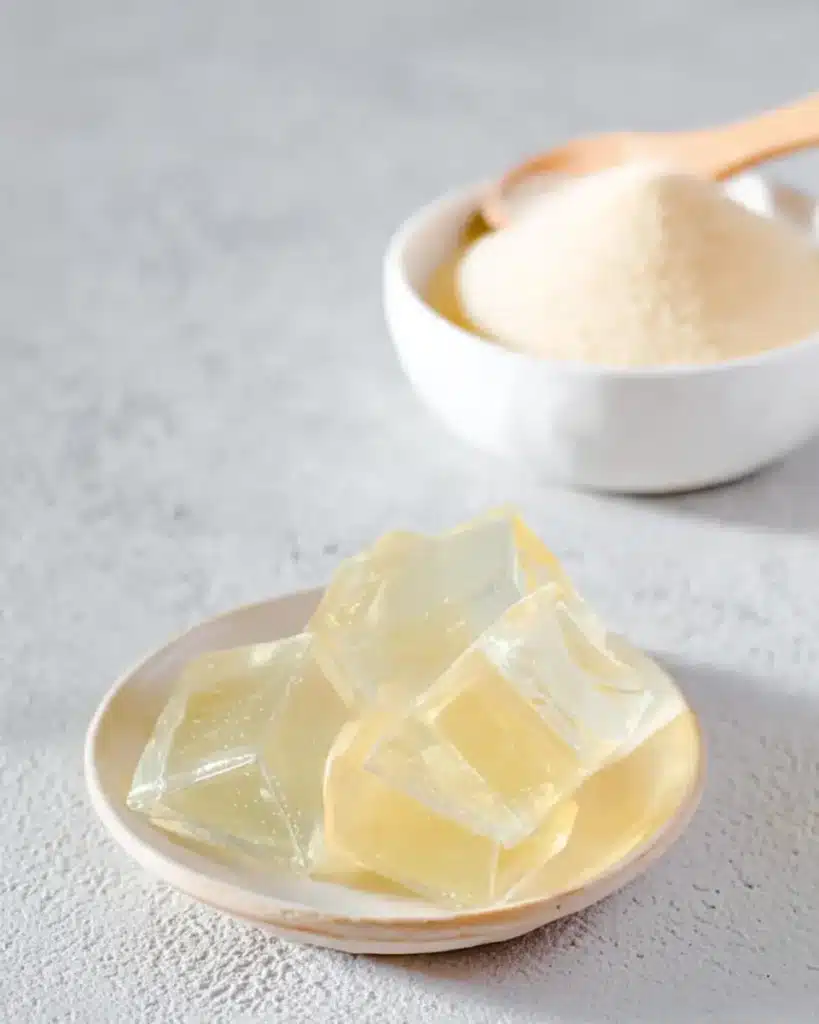Gelatin powder and set gelatin cubes illustrating why the gelatin trick works inside the stomach.