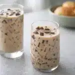 Coffee Jelly Drink recipe in two glasses with creamy vanilla milk and coffee jelly cubes